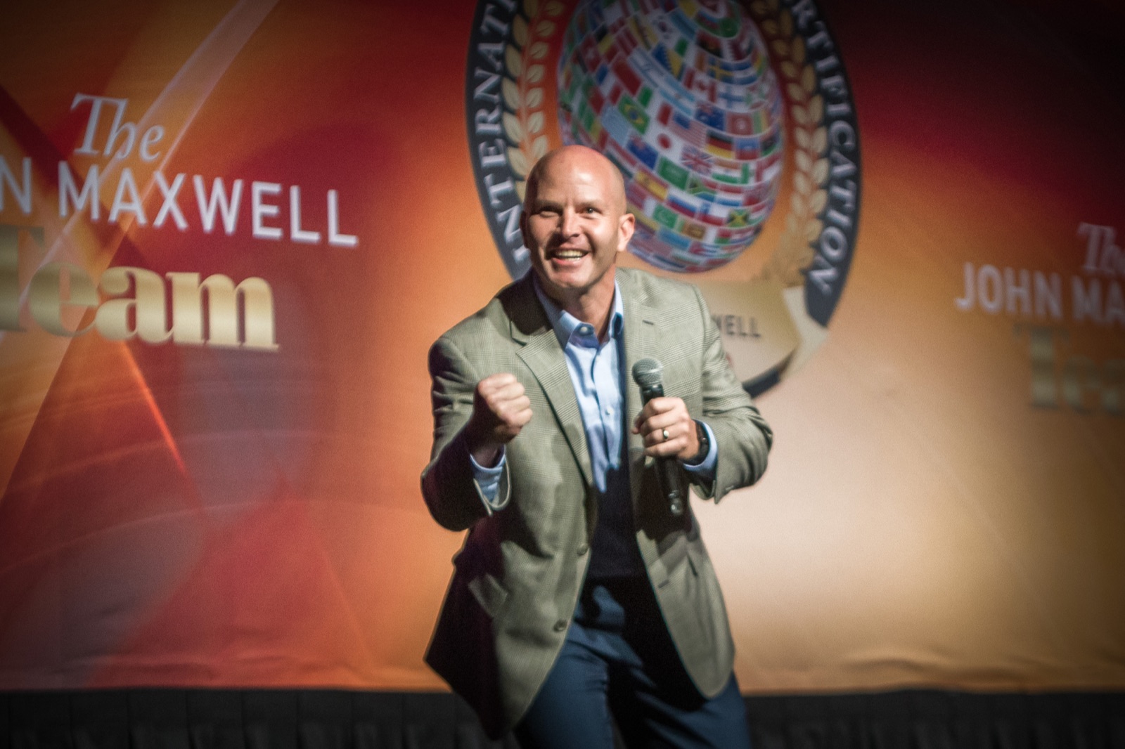 Kent Hyer speaking on stage as a John Maxwell Team certified trainer