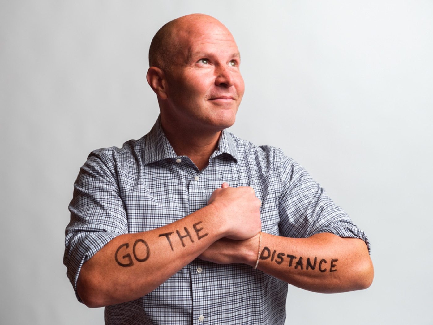Kent Hyer with Go The Distance written on his forearms